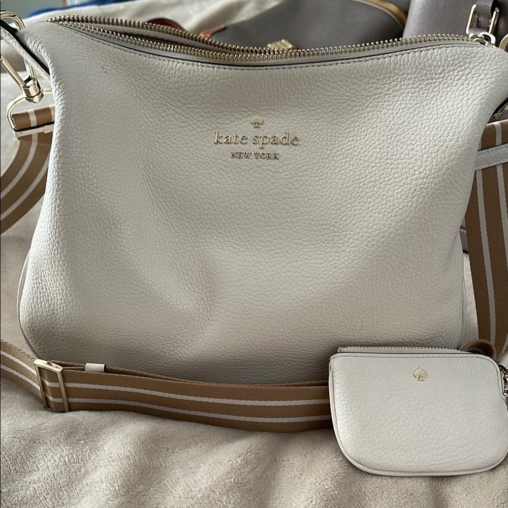 Kate Spade Off WhiteTextured Leather Crossbody w/adjustable straps.